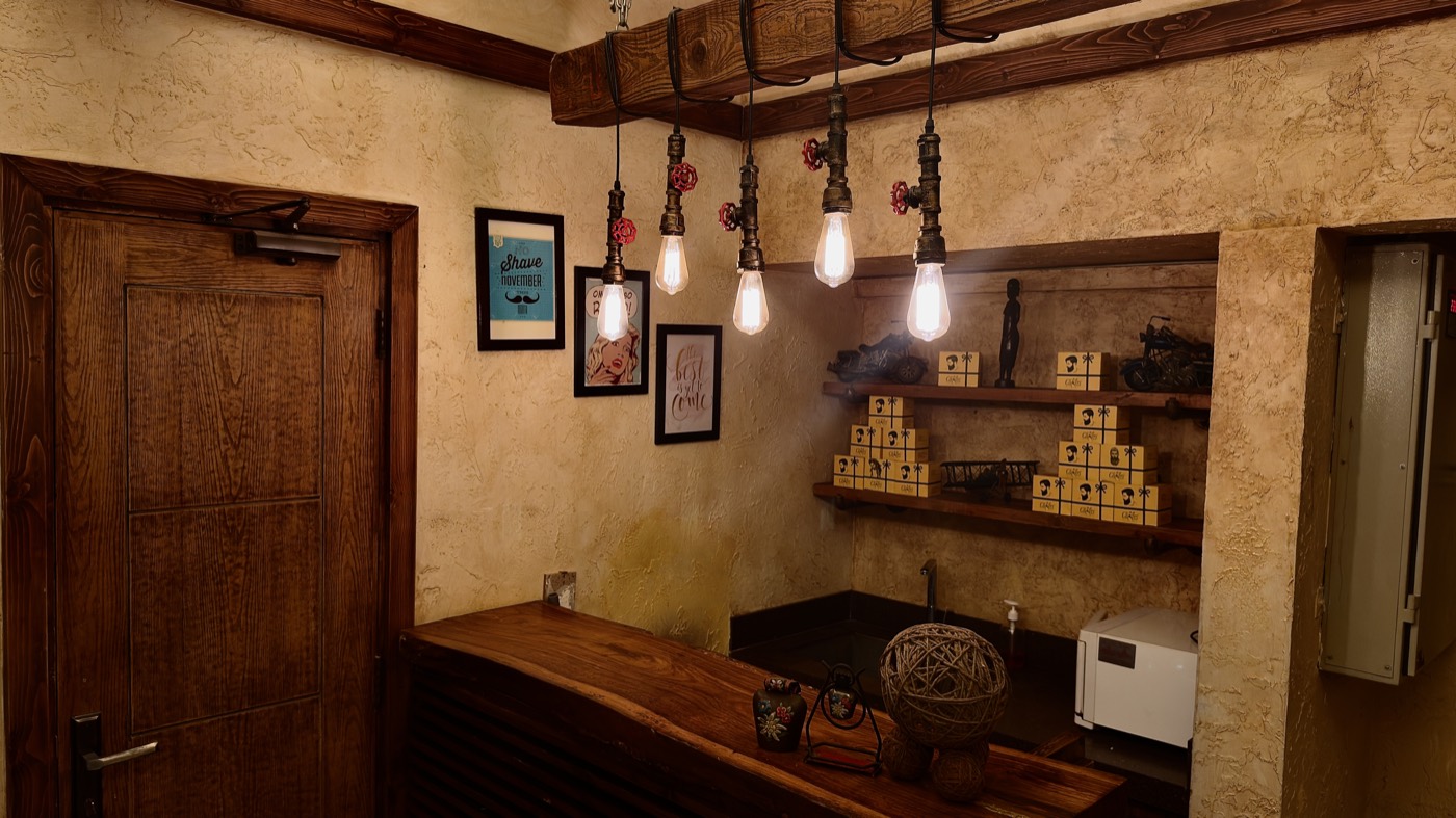 A counter lit by hanging pendant bulbs at the Zamzama branch