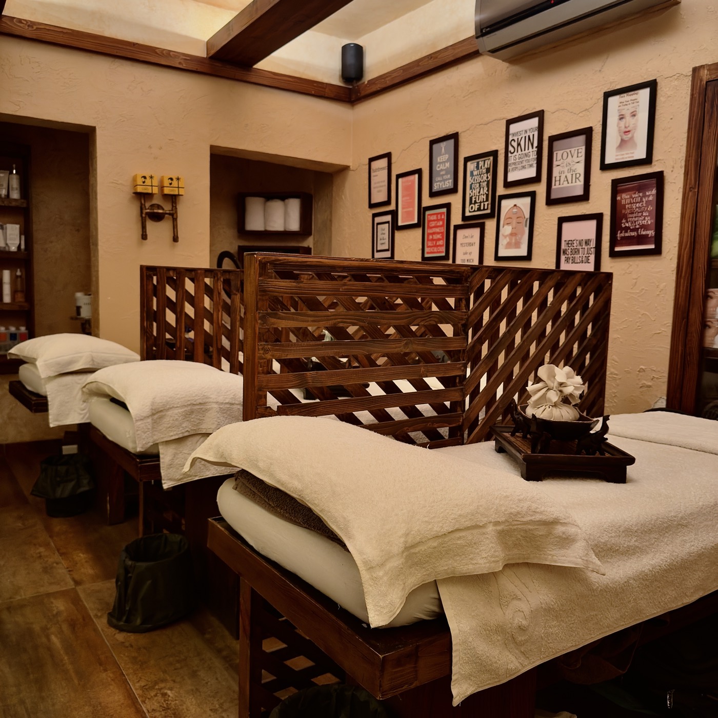 Treatment beds laid with fresh towels in the facial room at the Zamzama branch